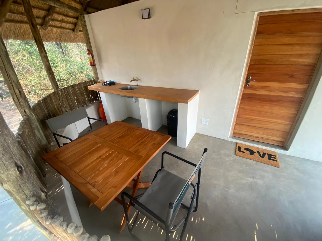 Outdoor kitchenette and dining area