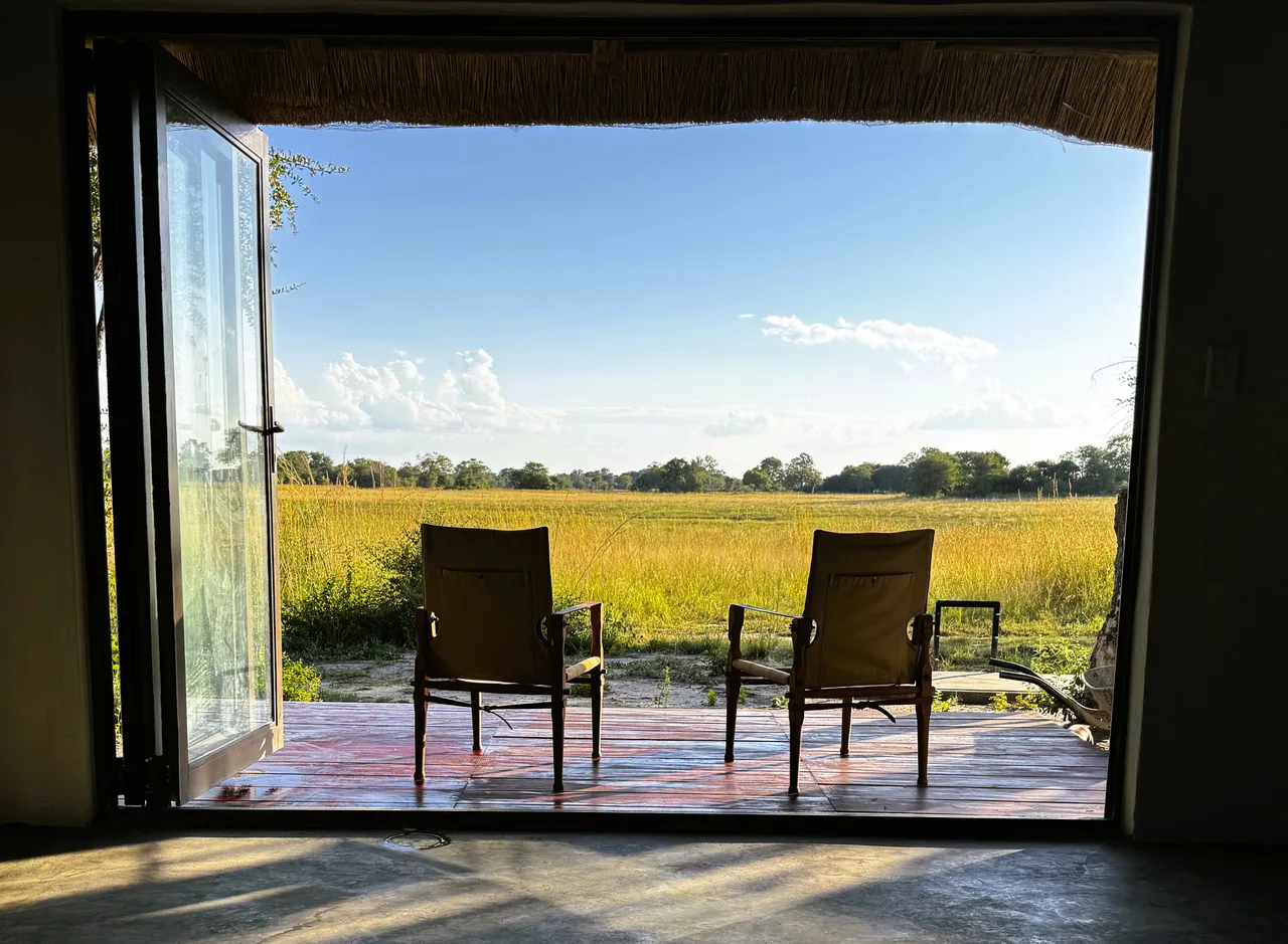 Two chairs on the chalet veranda overlooking the wetlands