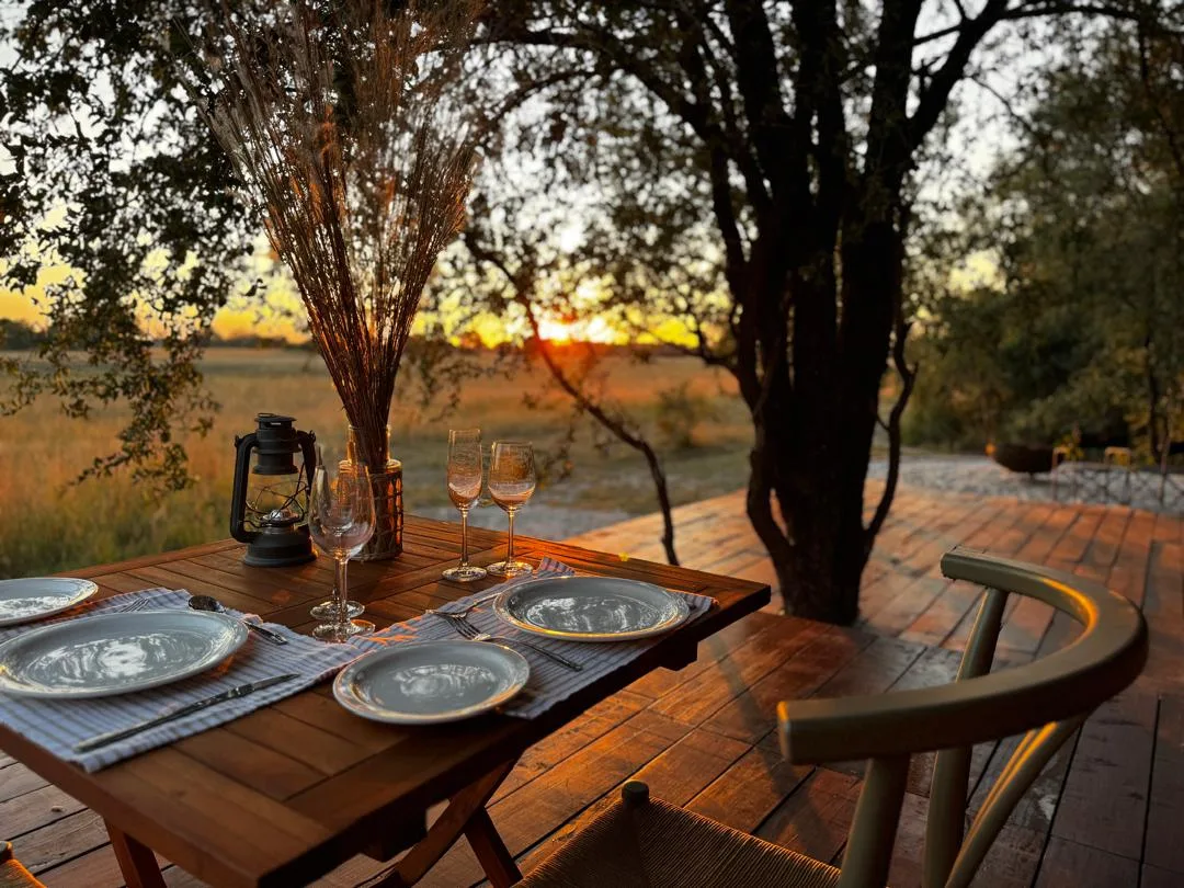 A dining table set on the deck overlooking the floodplain
